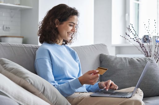 happy-young-customer-using-credit-card-to-make-purchase