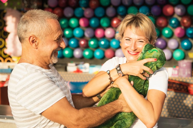 medium-shot-happy-woman-with-dinosaur-toy