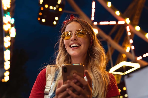 smiling-girl-with-phone-in-hand